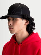 Alpinestars Maze Hat, Black Motorsport-Inspired Sportswear Cap for Men, featuring a Structured Crown, Curved Bill, and Textured Astars Corp Shift Logo, On-Model Side Profile View.