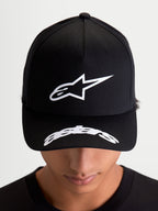 Alpinestars Arclight Hat, Black Sportswear Baseball Cap, on-model front view showing white puff-print Astars logo on a structured crown and curved word logo on the bill, motorsport-inspired casual wear.