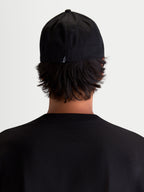 Alpinestars Arclight Hat, Black Sportswear Baseball Cap, Rear View on Model, Featuring a Small White Astars Logo on the Back, Structured Crown and Flex Back Construction, Durable Cotton Twill for Everyday Comfort.