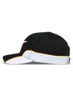 Alpinestars 500 Snapback Hat, Motorsport-inspired Sportswear Lifestyle Cap, Unisex, Black and White with Orange Contrast Piping, Curved Bill and Structured Crown, Durable Cotton Twill, Side View showing cut-and-sew detailing.