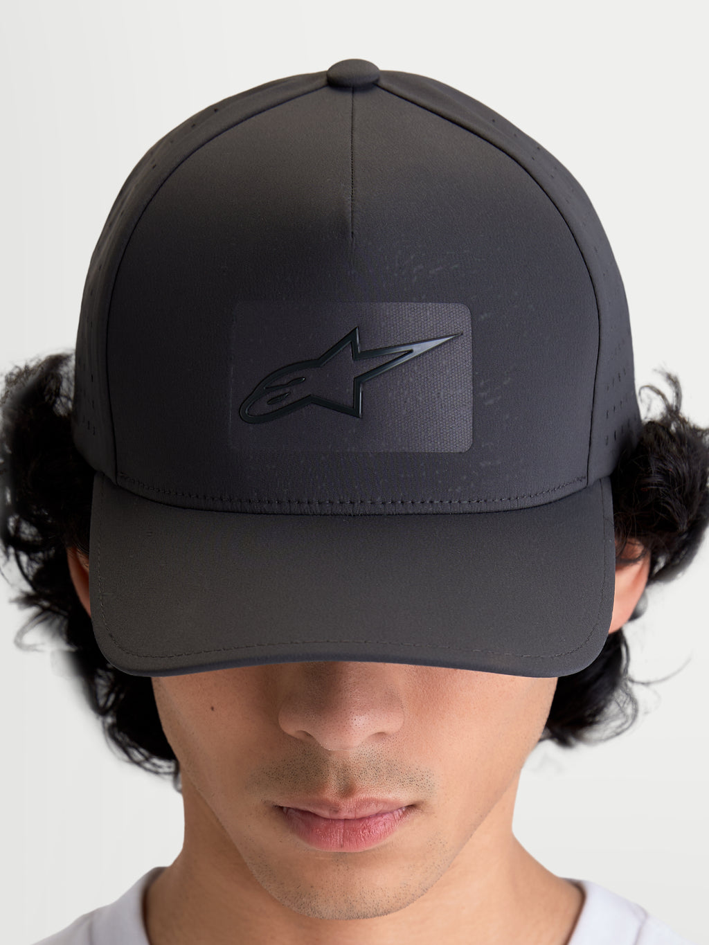 Alpinestars Algo Perf Adjustable Hat, Sportswear Baseball Cap, Dark Grey, featuring a structured crown, curved bill, and sonic-weld Astars logo with breathable side perforations, on-model front view.