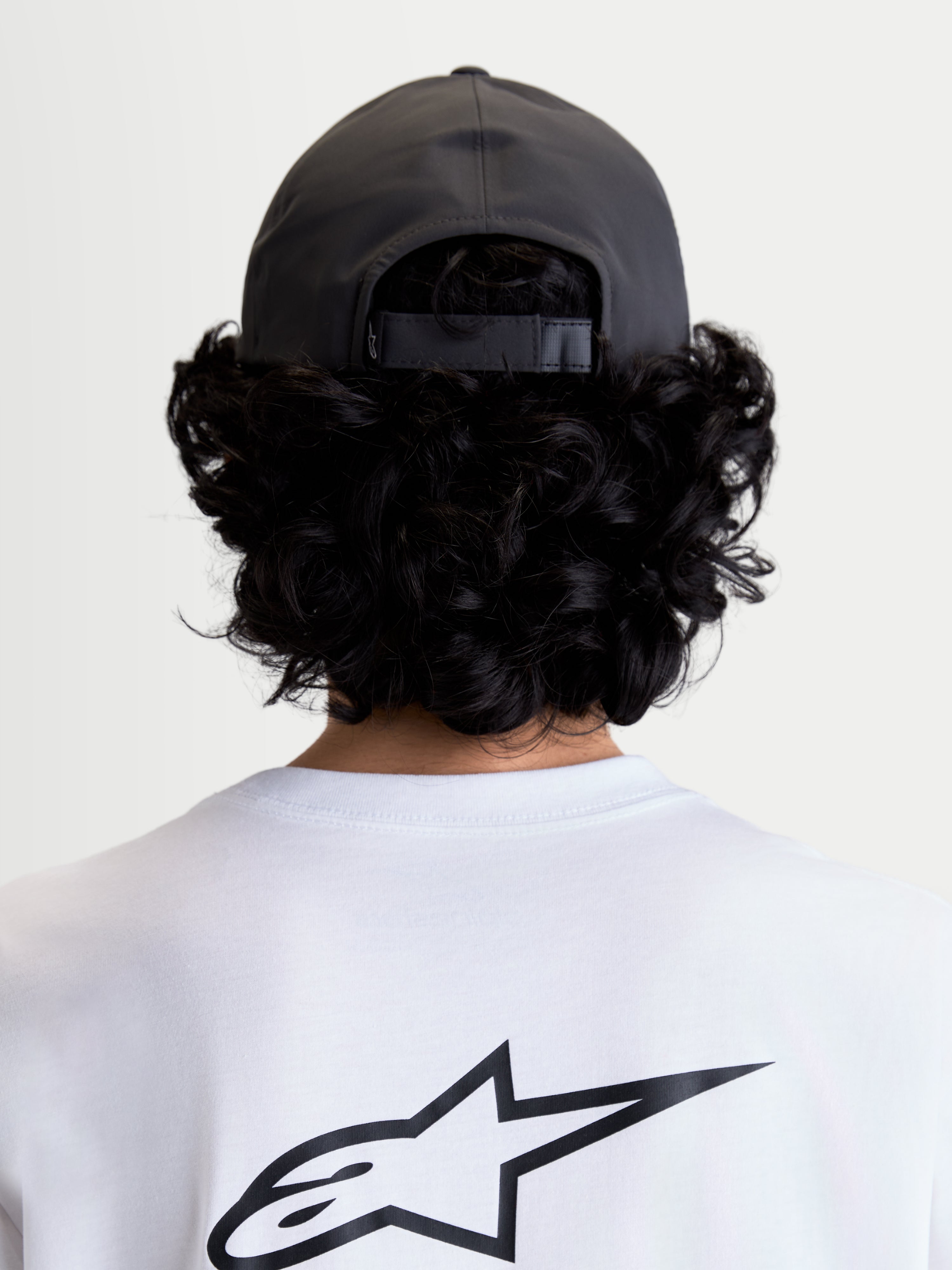 Alpinestars Algo Perf Adjustable Hat, Dark Grey Sportswear Cap, Technical Fabric Construction with Adjustable Back Closure, Rear View on Model showing Fit and Structured Crown.