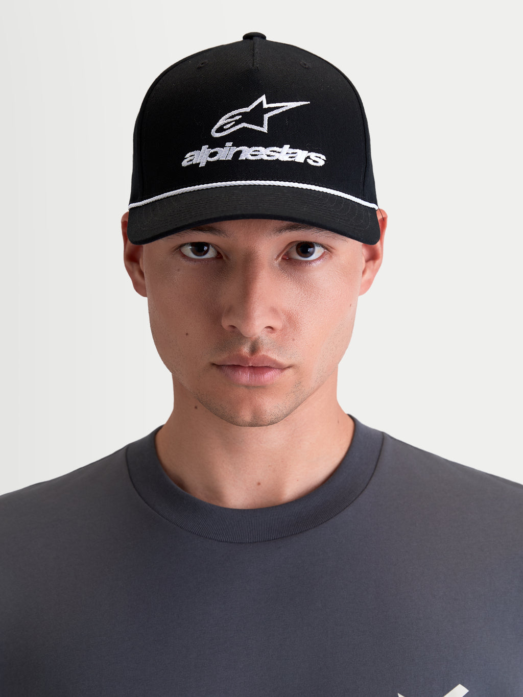Alpinestars Combo Logo Snapback Hat, Motorcycle Sportswear Cap, Unisex, Black and White, Features Curved Bill, Structured Crown, and Embroidered Astars Logo, 100% Cotton Twill, On-Model Front View.
