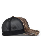 Alpinestars Thicket Realtree Trucker Hat in Camo and Black, side view featuring a curved bill and breathable mesh back.