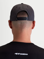 Alpinestars Stadium Snapback Hat, Dark Grey and Black Sportswear Cap, Rear View on Model showing the Adjustable Snapback Closure and Structured Crown, Durable Cotton Twill Construction