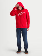 Alpinestars Ageless Zip V3 Hoodie, Red and White, Men's Full-Zip Sportswear Fleece on model, featuring a white Alpinestars chest logo, hood with drawcords, and ribbed cuffs. Ideal for casual motorsport fans.