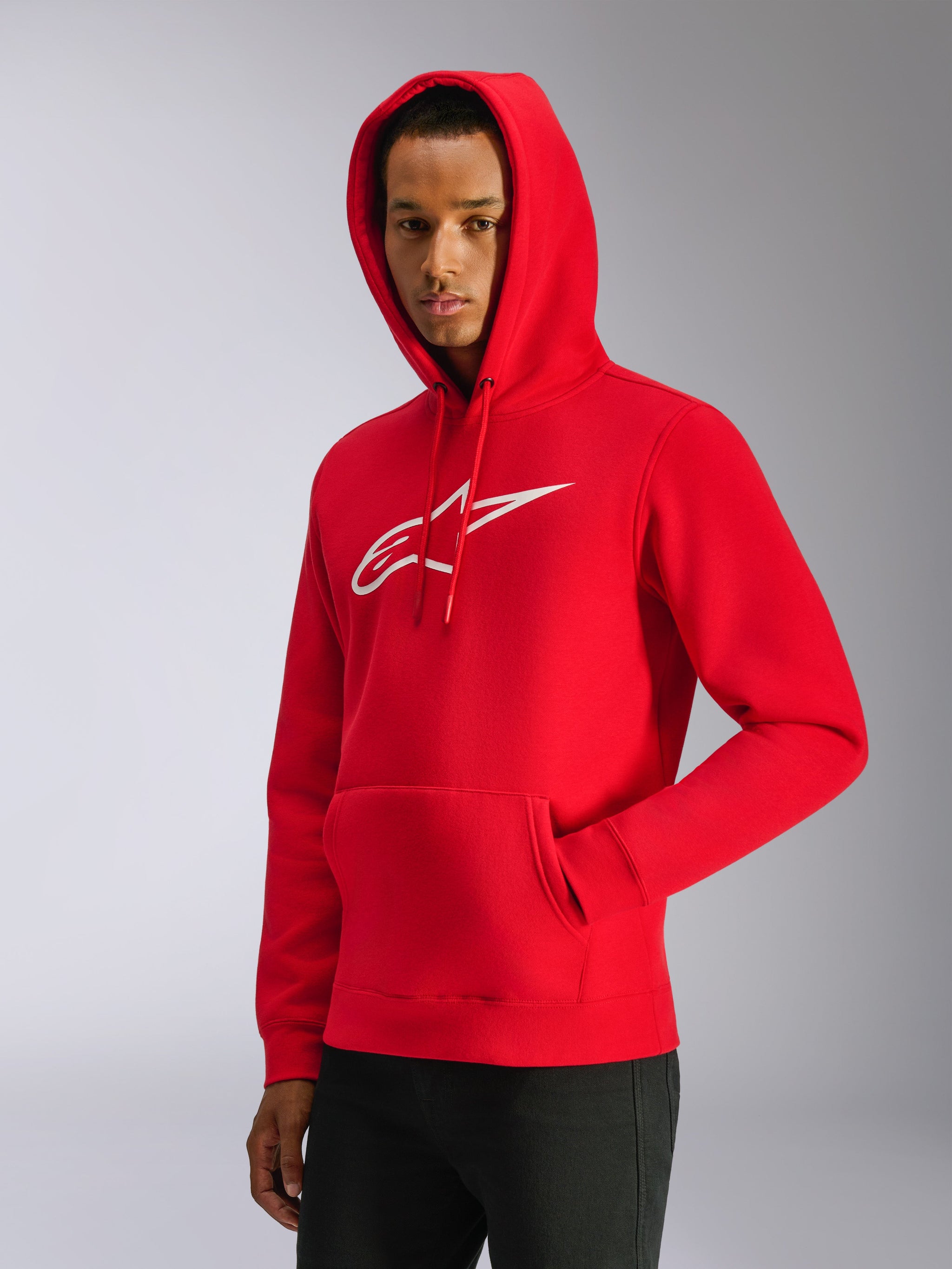 Alpinestars Ageless V3 Hoodie, red pullover fleece hoodie with white embroidered logo, hood with drawstrings, front kangaroo pocket, casual motorsport-inspired streetwear