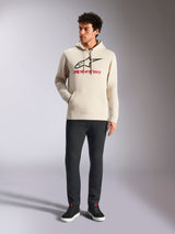 Alpinestars Always V3 Hoodie, casual streetwear, off-white with black star logo and red lettering, drawstring hood, long sleeves, worn by male model with black pants and black sneakers