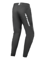 Alpinestars A-Dura Elite Pants, Mountain Bike Pants, Black, rear side view featuring silver Alpinestars branding on the thigh, zippered pocket, and elasticated cuffs, durable technical gear for MTB