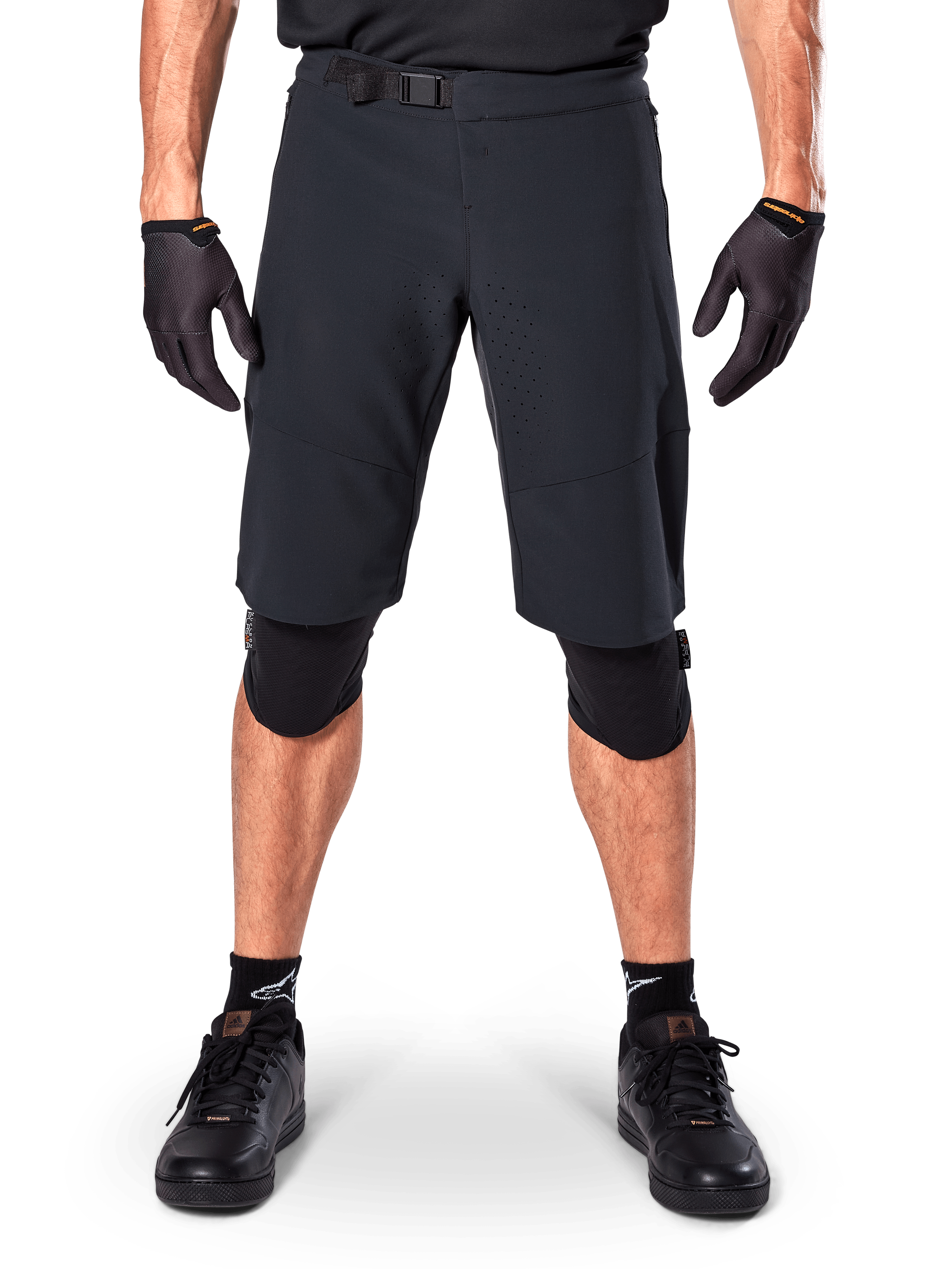 Alpinestars A-Aria Elite Shorts, Mountain Bike Shorts, Black, worn with knee pads and black gloves, featuring laser-cut ventilation and an adjustable buckle waist, performance off-road cycling gear