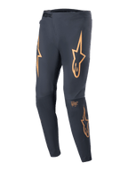 Alpinestars A-Supra Race Pants, MTB Racing Pants, Black with prominent orange star logos on the thighs, featuring a front ratchet closure, laser-perforated ventilation, and a tapered athletic fit.