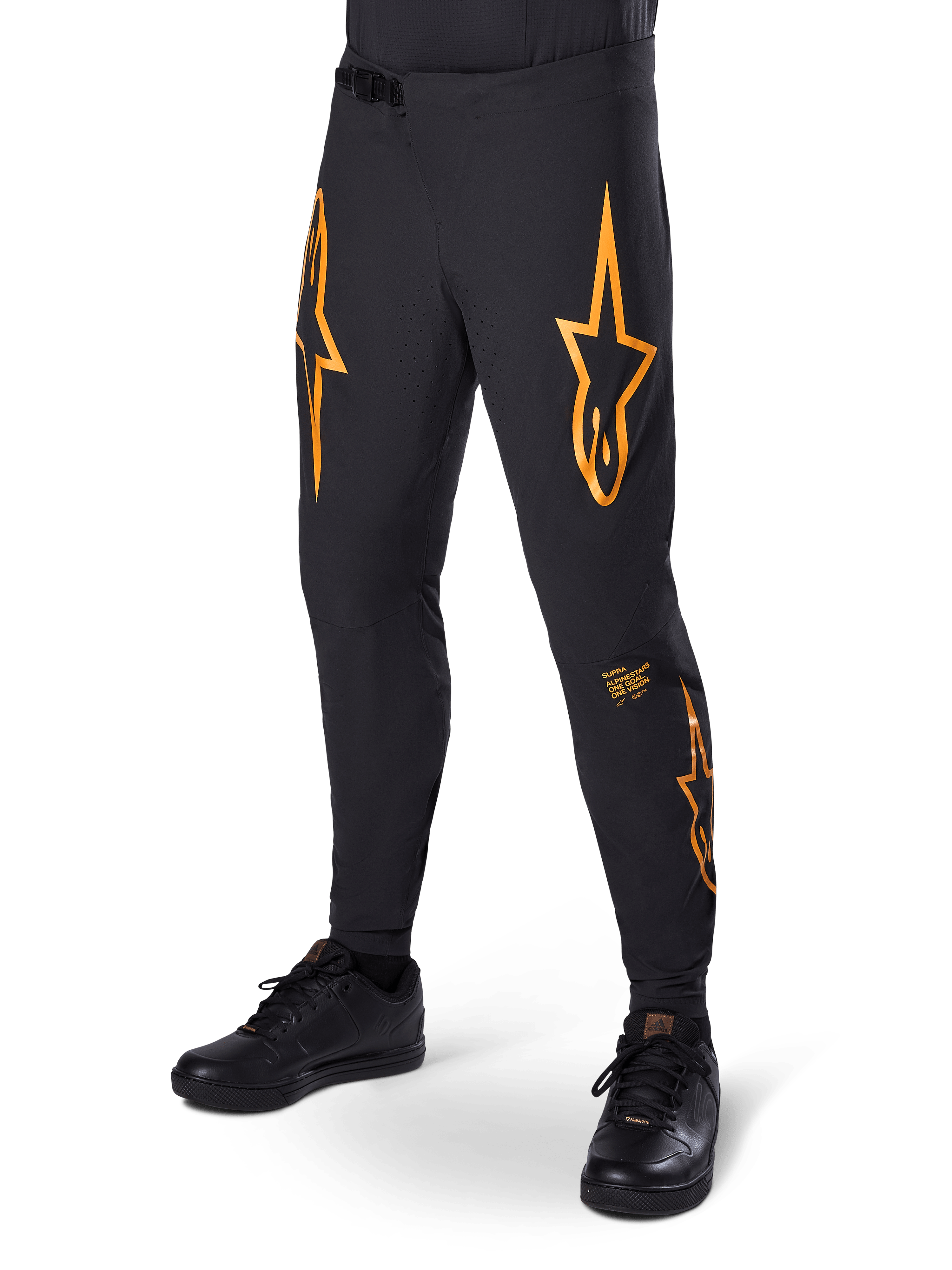 Alpinestars A-Supra Race Pants, Black with orange star graphics, MTB racing pants featuring laser-perforated ventilation and ratchet waist closure, slim performance fit for off-road cycling