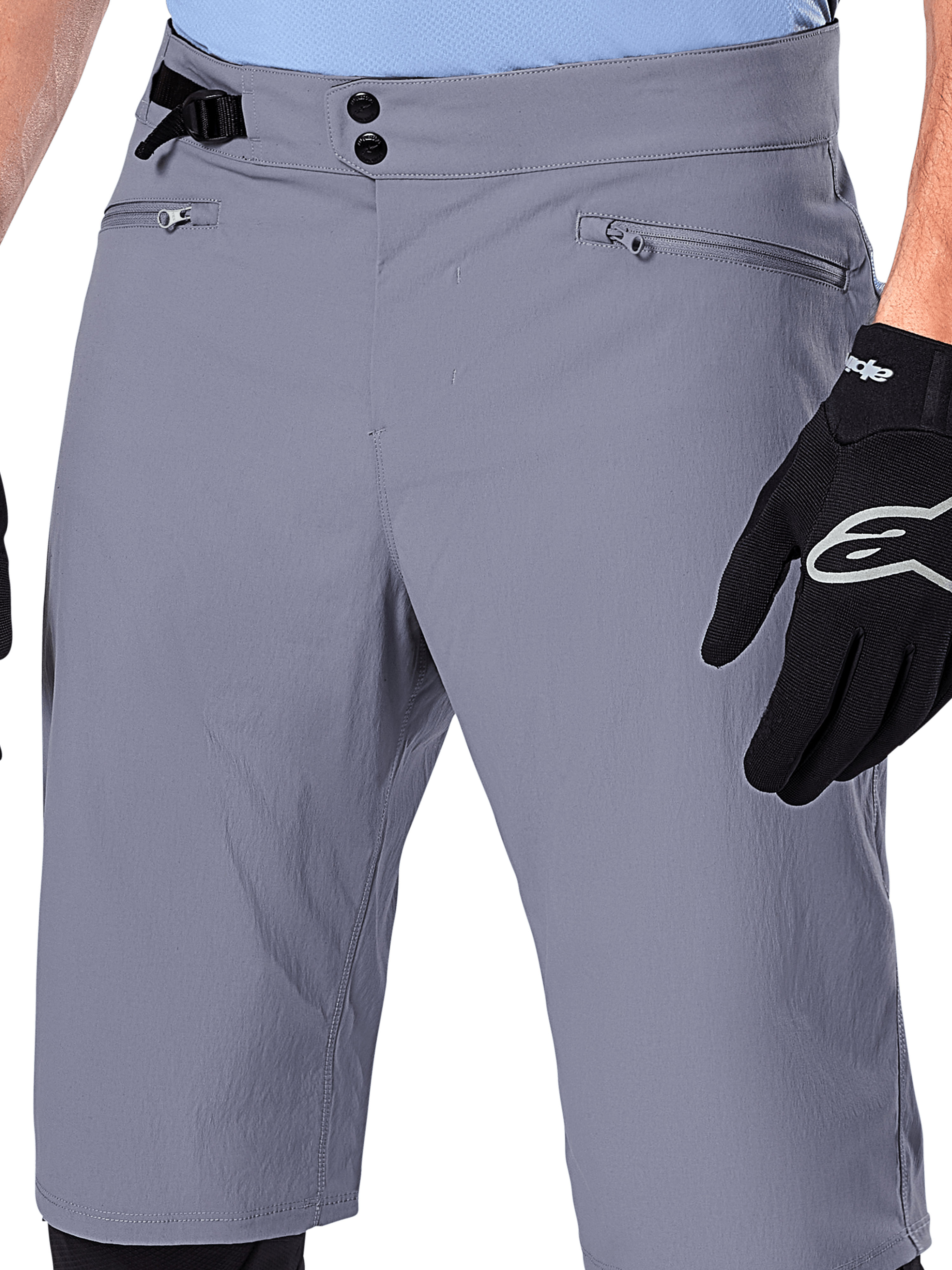 Alpinestars A-Dura Shorts, MTB Shorts, Dark Gray, close-up view of waist showing double snap closure, side cinch adjuster, and zippered pockets, paired with black cycling gloves, durable mountain bike apparel.