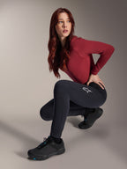 Alpinestars Stella A-Dura Thermal Pants, Women's MTB Pants, Black, worn by a model in a crouching pose with a maroon long-sleeve top and black cycling shoes, featuring a white star logo on the thigh, durable and warm construction for cold-weather off-road riding