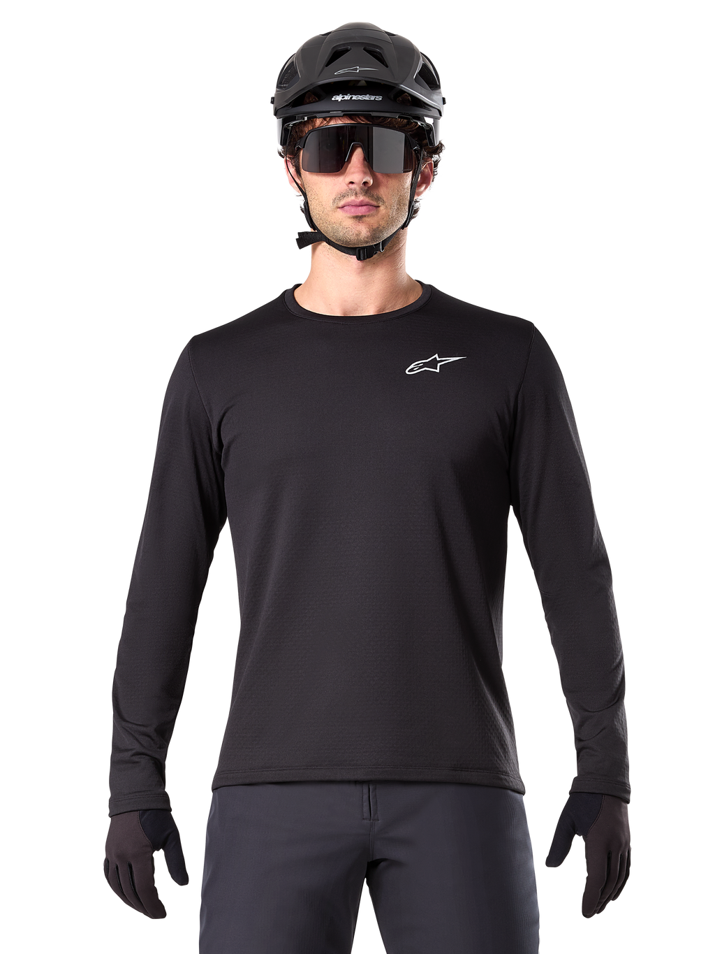 Alpinestars A-Dura Thermal Jersey, Black long-sleeve mountain bike jersey, worn with a black helmet and large sunglasses, featuring a small white Alpinestars logo on the chest, regular fit, MTB cycling apparel