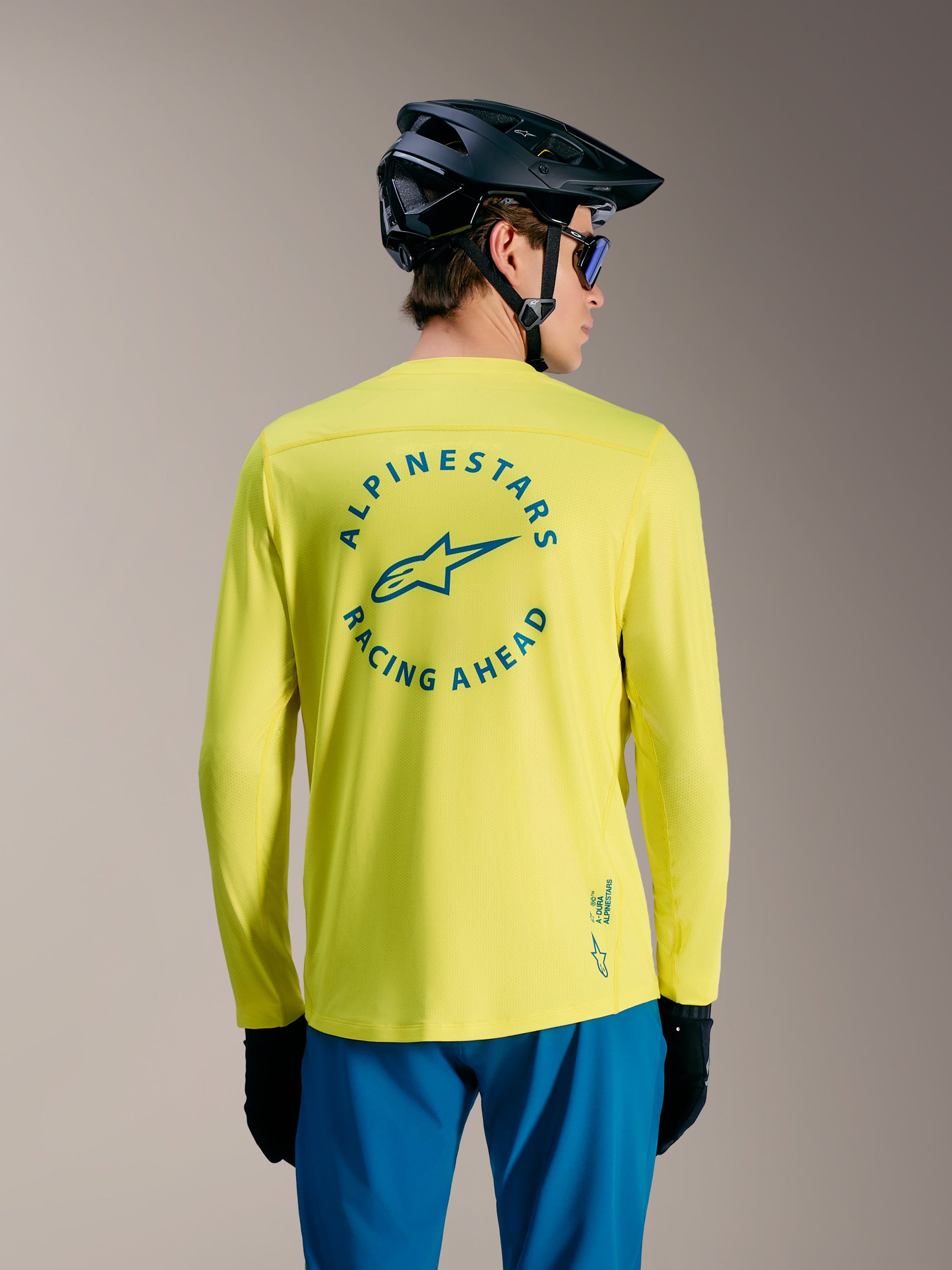 Yellow Fluo A-Dura Air Long Sleeve Jersey with Alpinestars Racing Ahead back graphic, high-performance MTB apparel.