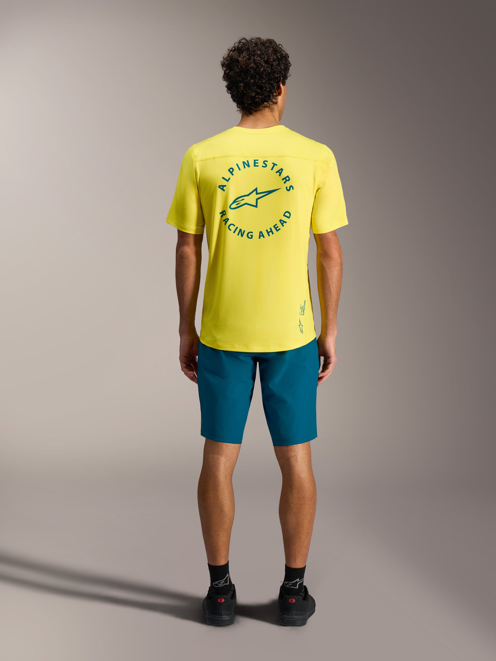 Yellow A-Dura Air SS Jersey with teal back logo and Blue Green A-Dura Ride Shorts, professional MTB cycling apparel.