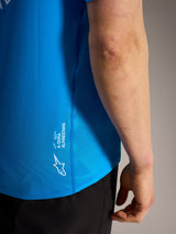 Bright Blue A-Dura Air Jersey, close-up of breathable mesh fabric with white Alpinestars branding near the lower hem.