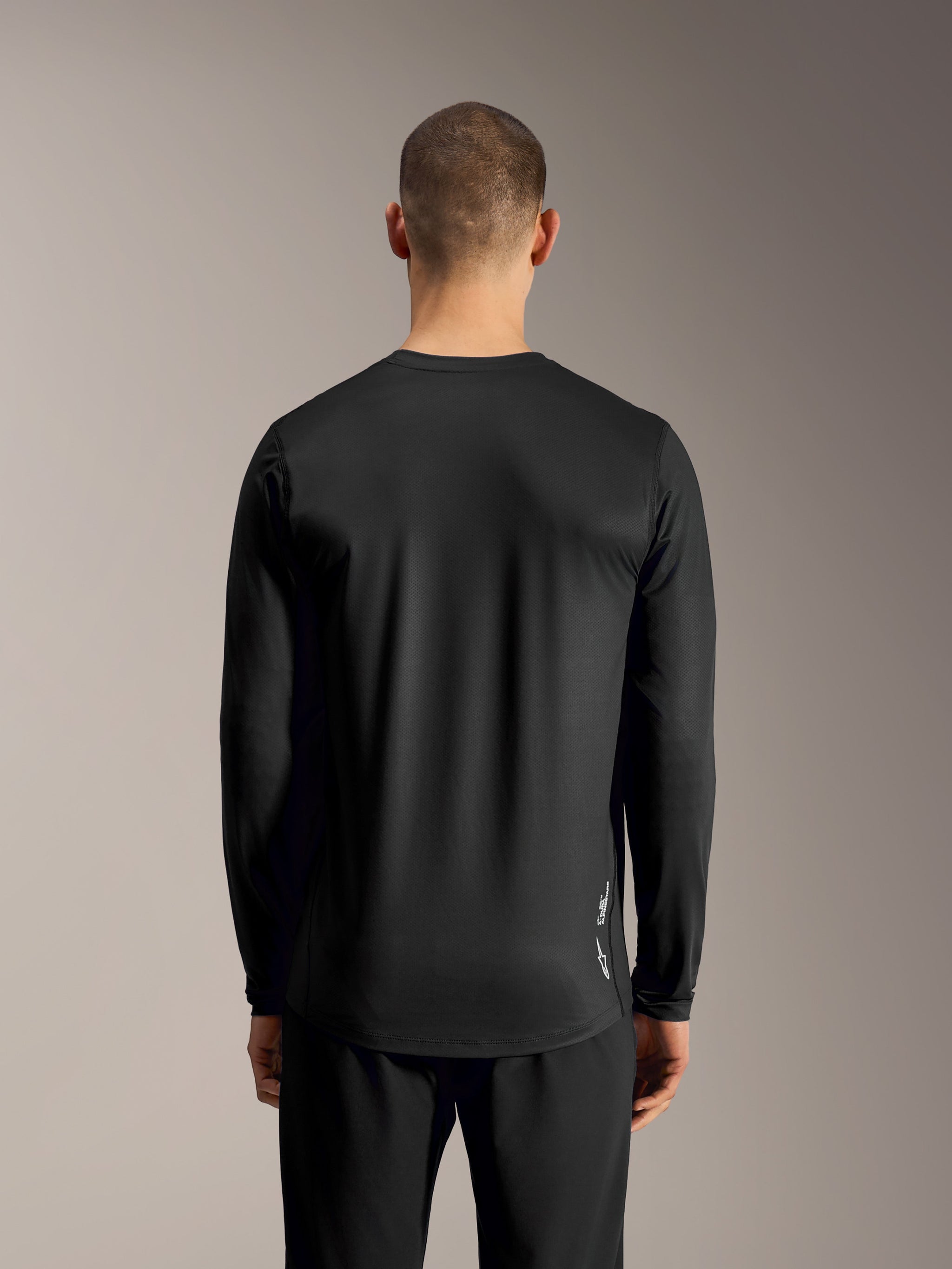 Black A-Dura Ride Long Sleeve Jersey, performance mountain bike top featuring a breathable jacquard knit, rear view.