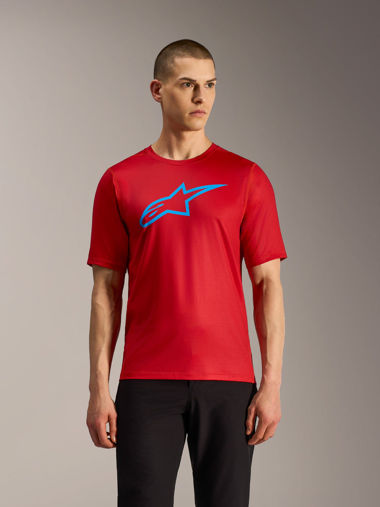 Red A-Dura Ride Short Sleeve Jersey featuring a blue Alpinestars logo, lightweight performance MTB gear.