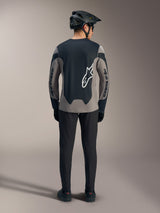 Rear view of the Gray A-Dura Race Long Sleeve Jersey, featuring black panels and white Alpinestars logos for MTB riding.