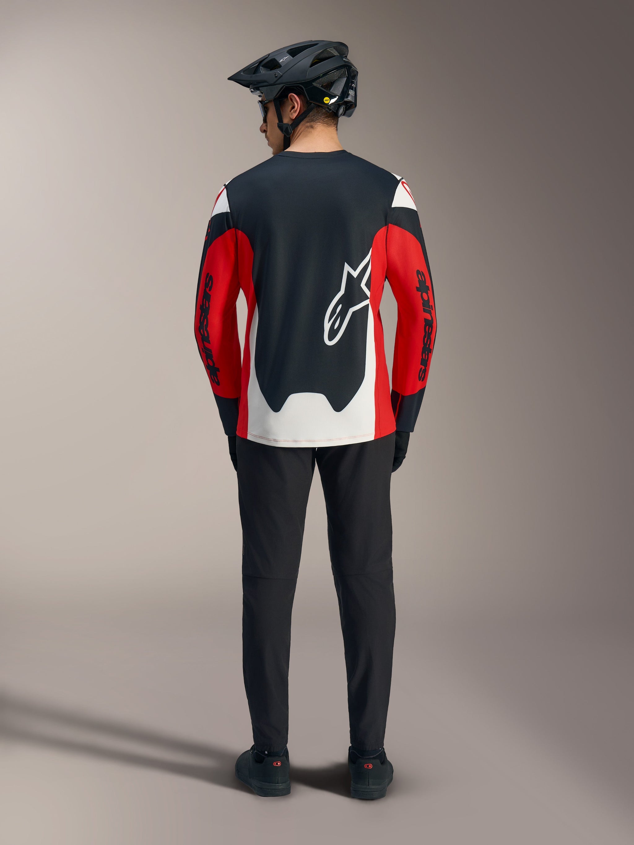 Red A-Dura Race Long Sleeve Jersey with black and white panels and a large Astars logo on the back for MTB performance.