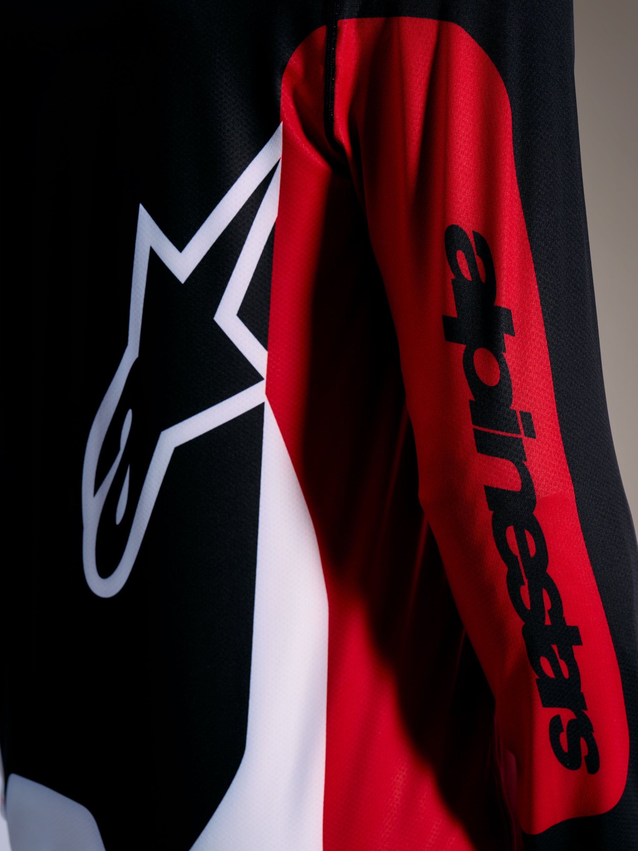 Red A-Dura Race Jersey featuring a white Astars logo and black wordmark on the sleeve, performance MTB apparel.