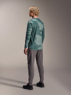 Alpinestars A-Dura Hollow Camo Long Sleeve Jersey, Silver Pine Camo, back view of model wearing green camo jersey with grey pants and black shoes, showing drop tail and camo pattern, performance mountain bike gear
