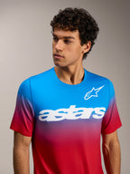 A-Dura ASTARS 2.0 short sleeve jersey in bright red and blue gradient featuring a white chest logo for MTB performance.