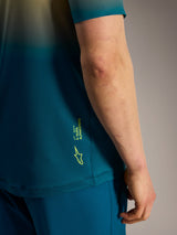 Alpinestars A-Dura ASTARS Jersey 2.0 detail in blue green, featuring a fluo yellow logo and branding on the side.