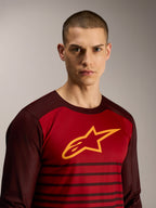 A-Dura Elite Long Sleeve Jersey in Bordeaux, featuring a yellow star logo and striped pattern for MTB performance.