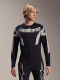 Alpinestars A-Supra Melt Jersey Long Sleeve, MTB Mountain Bike Jersey, Black and Gray, featuring 'astars' graphic across the chest and patterned sleeves, worn with matching performance pants