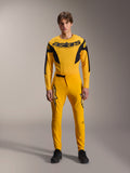 Limited Edition A-Supra Melt Gold Gear Set, Alpinestars Mountain Bike Apparel, Dark Yellow and Black, Model wearing long-sleeve jersey with bold 'astars' chest logo and matching performance pants, featuring laser-cut ventilation on inner thighs and a secure ratchet waist closure, professional MTB racing kit
