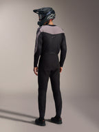 Alpinestars A-Supra Elite MTB kit in black and grey, featuring a performance jersey and matching racing pants from the back.