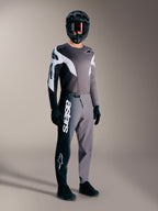 A-Supra Elite Jersey, Faded Gray long-sleeved MTB racing top with black and white accents on a rider in full gear.