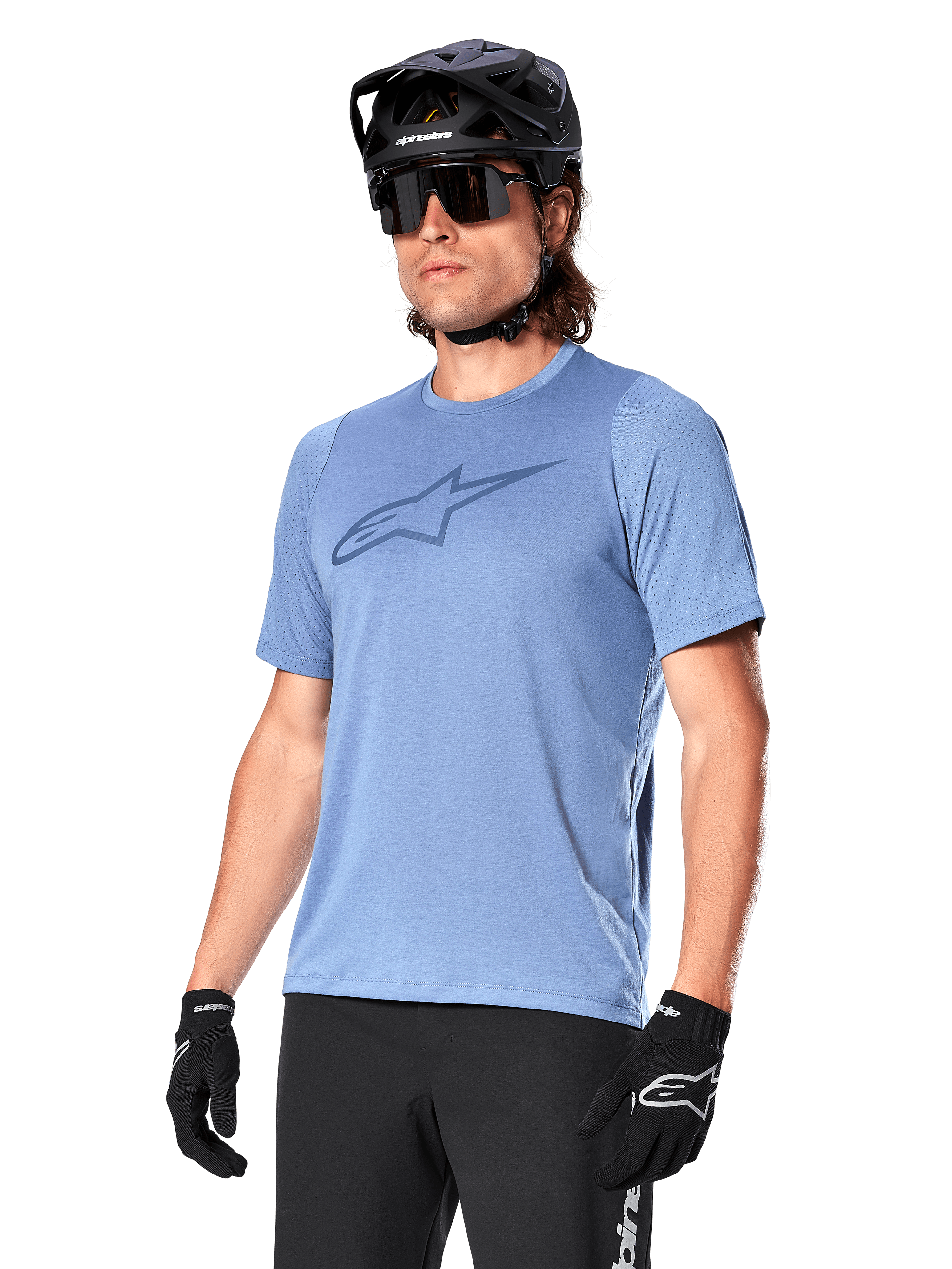 Alpinestars A-Dura Dri Astar Jersey Short Sleeve, Infinity Blue, mountain bike jersey with mesh sleeve ventilation and a large chest logo, worn with black helmet, sunglasses, and gloves, technical MTB performance apparel