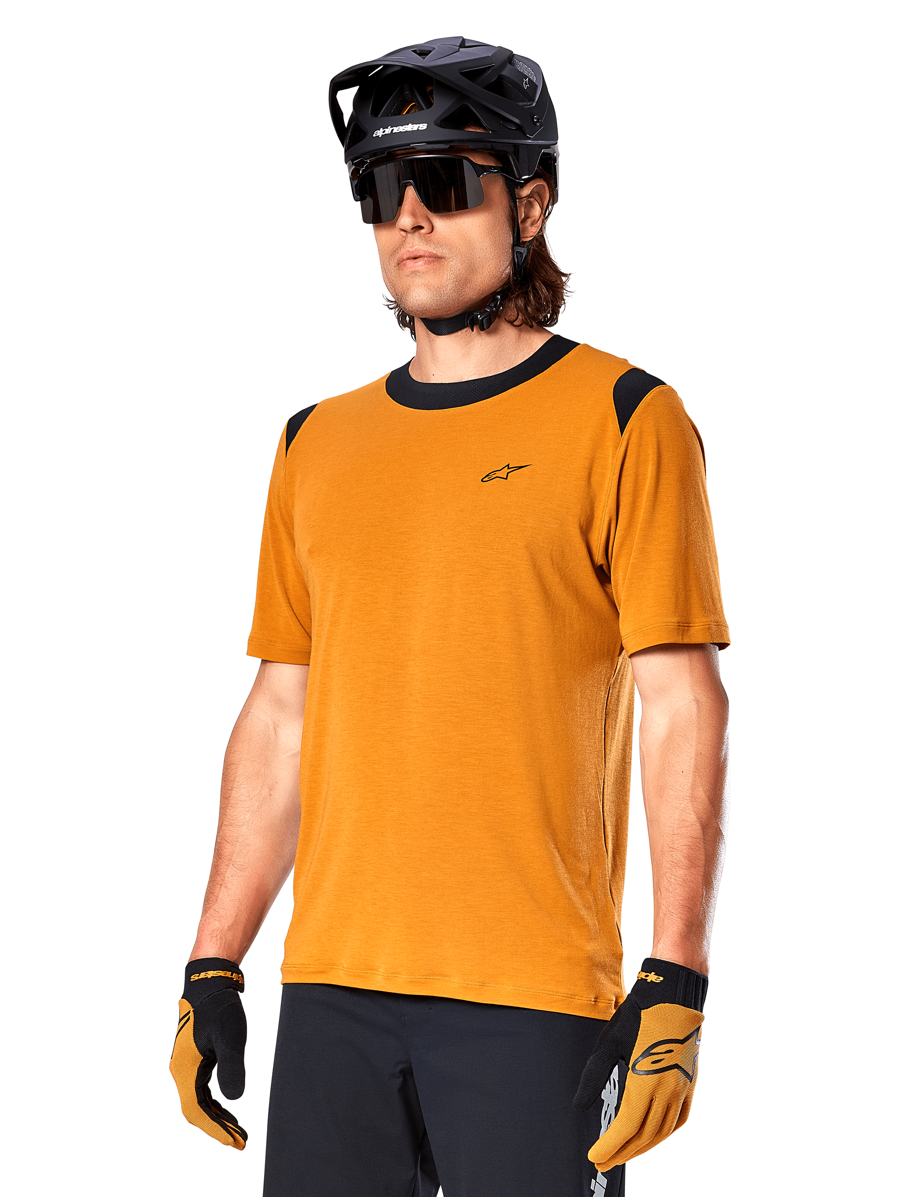 Alpinestars A-Dura Dri Wool Jersey - Short Sleeve, MTB cycling jersey, Dark Gold with black accents, short-sleeve technical wool blend shirt with black shoulder panels, worn with black mountain bike helmet and matching gloves