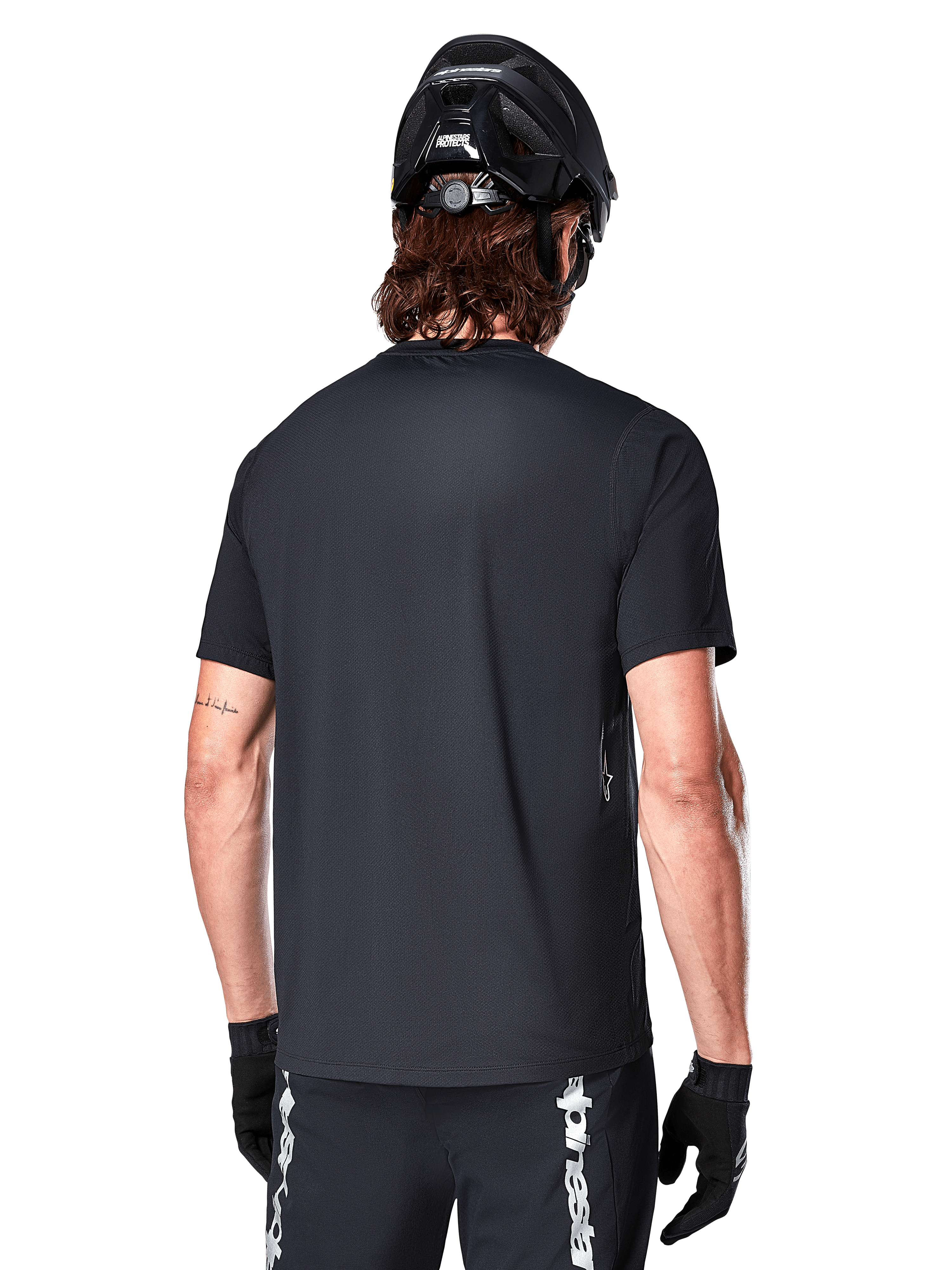 Alpinestars A-Dura Switch Jersey, Black men's short sleeve MTB jersey, rear view highlighting the drop tail and regular fit.