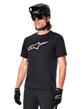 Alpinestars A-Dura Dri Oscar Jersey, Short Sleeve MTB Cycling Shirt, Black with white logo, moisture-wicking performance fabric, worn with black helmet, sunglasses, and gloves