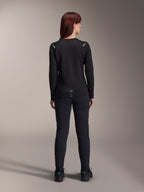 Alpinestars Woman Stella A-Dura Thermal Jersey, Back View, Black, Long-sleeve cycling jersey with insulated fleece, worn with matching black pants and shoes, featuring small A-Dura branding on the lower back and reflective shoulder accents, tailored for women's MTB riding.