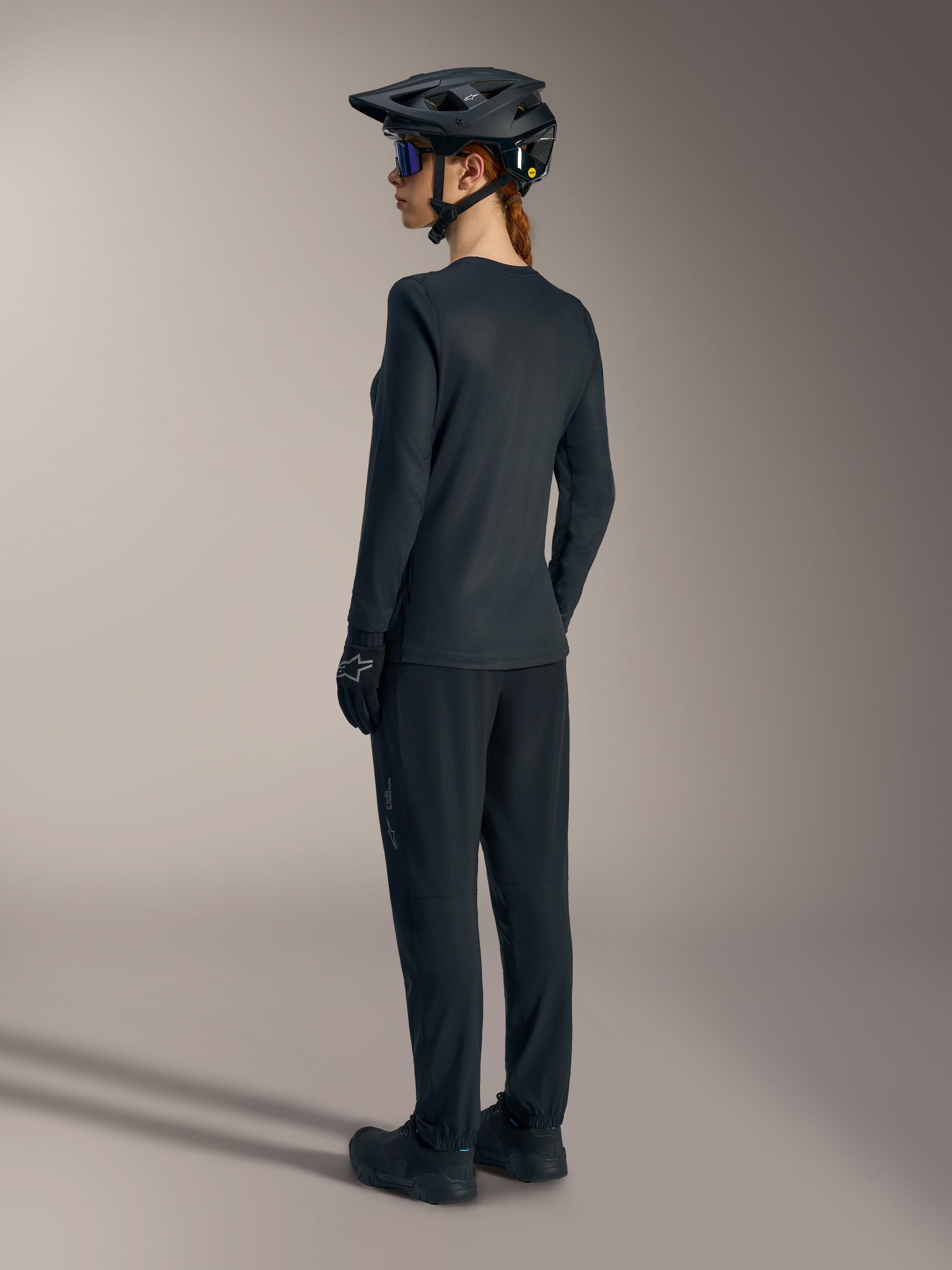 Stella A-Dura Ride Long Sleeve Jersey in black, lightweight women's MTB top with a drop tail for mountain bike performance.