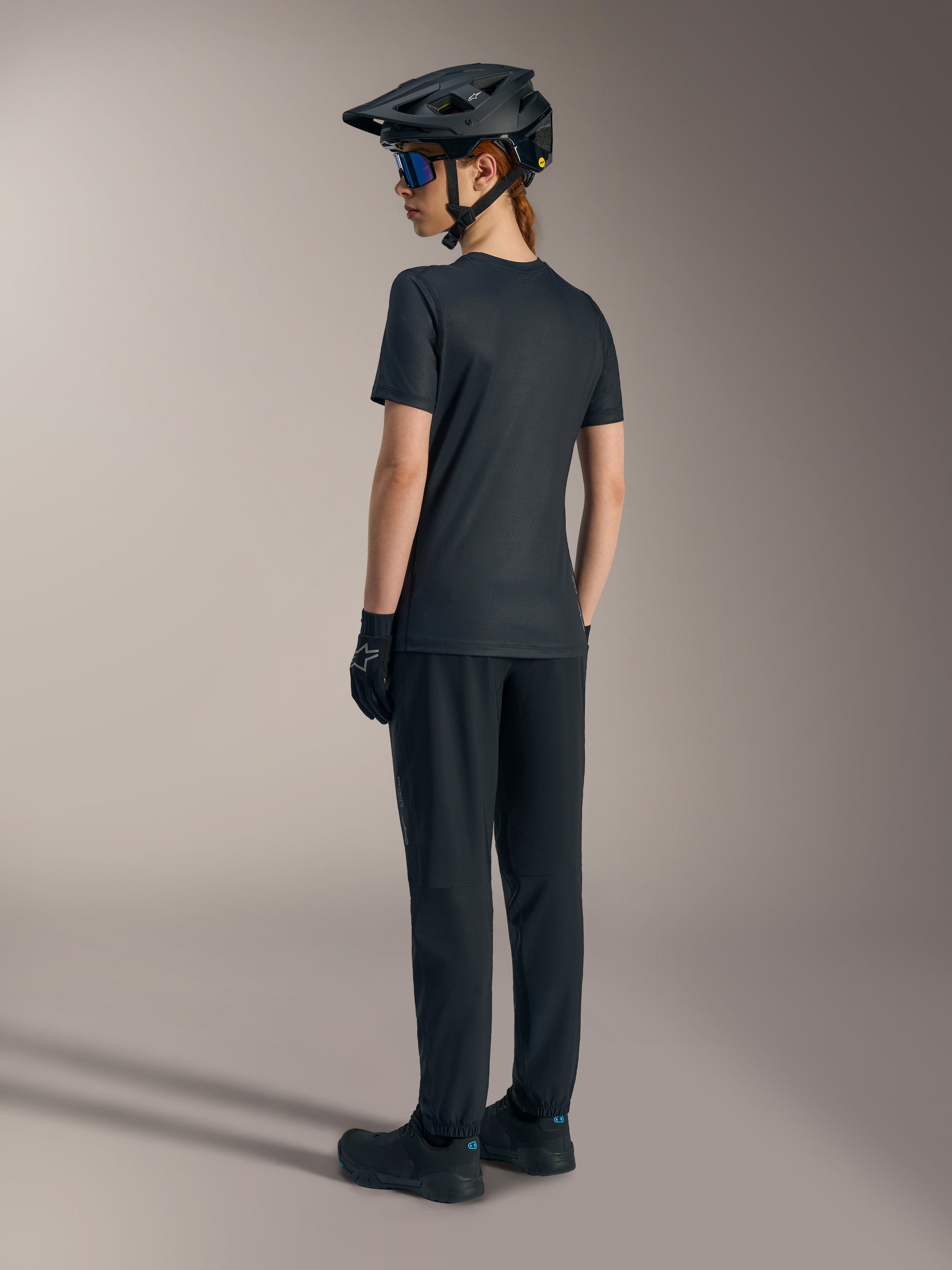 Women's Stella A-Dura Ride Jersey in black, short sleeve jacquard MTB top for performance riding, shown from the back.