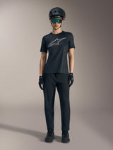 Women's Stella A-Dura Ride SS Jersey in black with silver logo, styled with MTB pants and helmet for off-road riding.