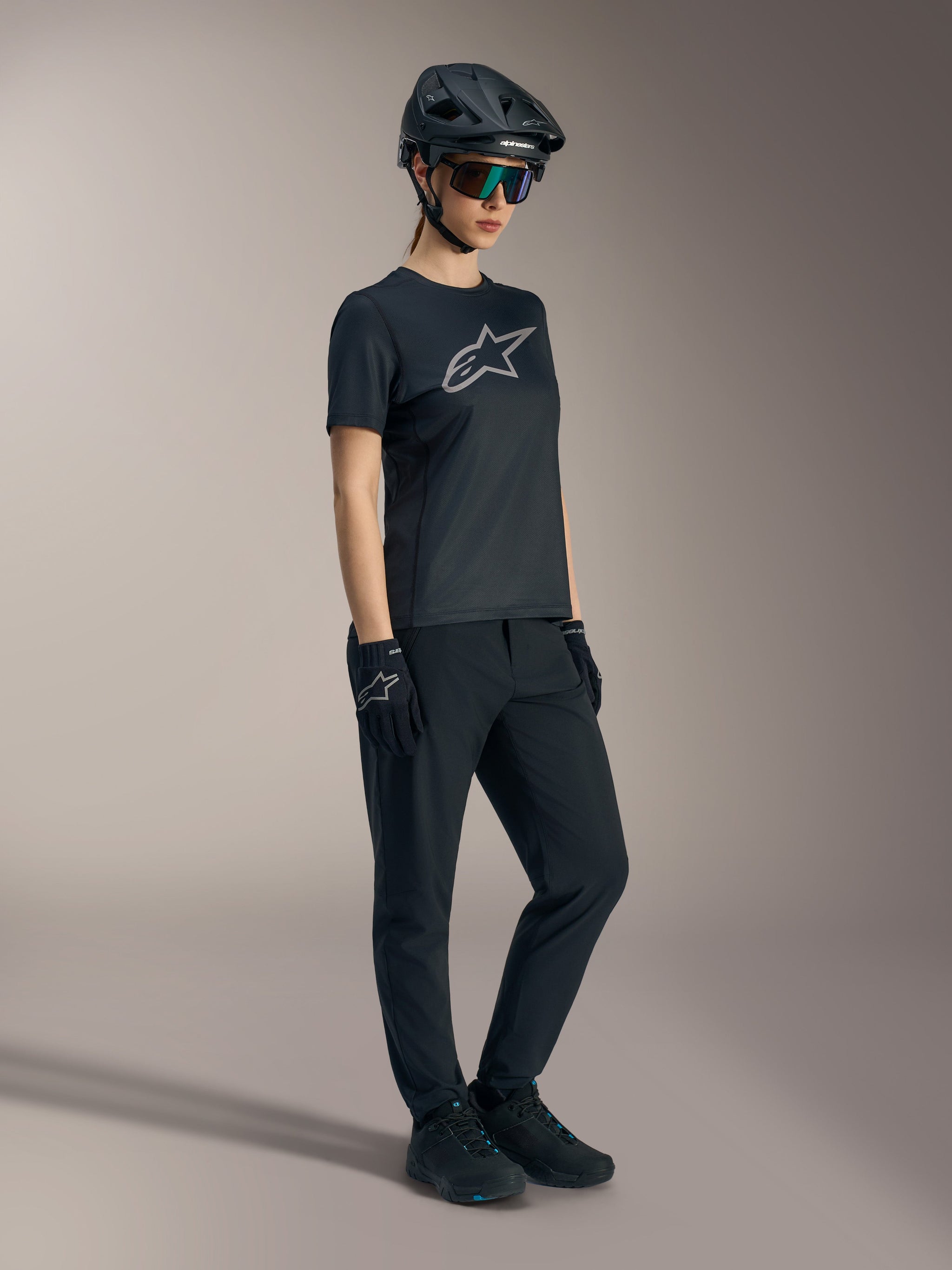 Stella A-Dura Ride Jersey in black, women's short sleeve MTB top featuring a silver Alpinestars logo on the chest.