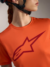 Orange Women's Stella A-Dura Ride Jersey with a large dark red Alpinestars chest logo, performance MTB apparel.