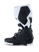 Alpinestars 2026 Tech 7 Enduro Boots, Motocross Boots, Black and White, side profile view showing durable TPU protection panels, textured medial grip section with Tech 7 branding, and heavy-duty buckle closure system for off-road riding.