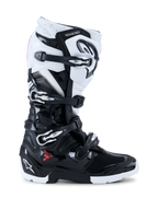 Alpinestars 2026 Tech 7 Enduro Boots, Off-Road Motorcycle Boots, Black and White, featuring four metallic buckles, high-impact TPU protection panels, rugged dual-compound sole, and bold Alpinestars branding on the heel and shin