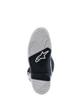 Alpinestars Tech 7 Boots sole view, Motocross Boots, Light Gray and Black, featuring a dual-compound vulcanized rubber sole with a white Alpinestars logo, red wear limit indicator, and high-traction textured grip pattern.