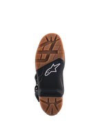 Alpinestars Tech 7 Enduro Boots, close-up view of the sole, featuring a brown rubber tread pattern and a black central section with a white star logo, highlighted replaceable footpeg insert for superior off-road grip.
