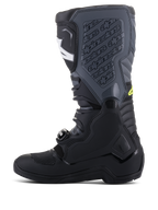 Alpinestars Tech 5 Boots, Motocross Boots, Black and Cool Gray with Yellow Fluo accents, side profile showing tall multi-panel construction, buckle closure system, and textured shin plate with embossed branding, off-road racing footwear